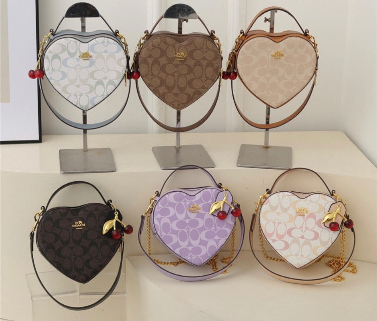 Heart shape coach bag with charm